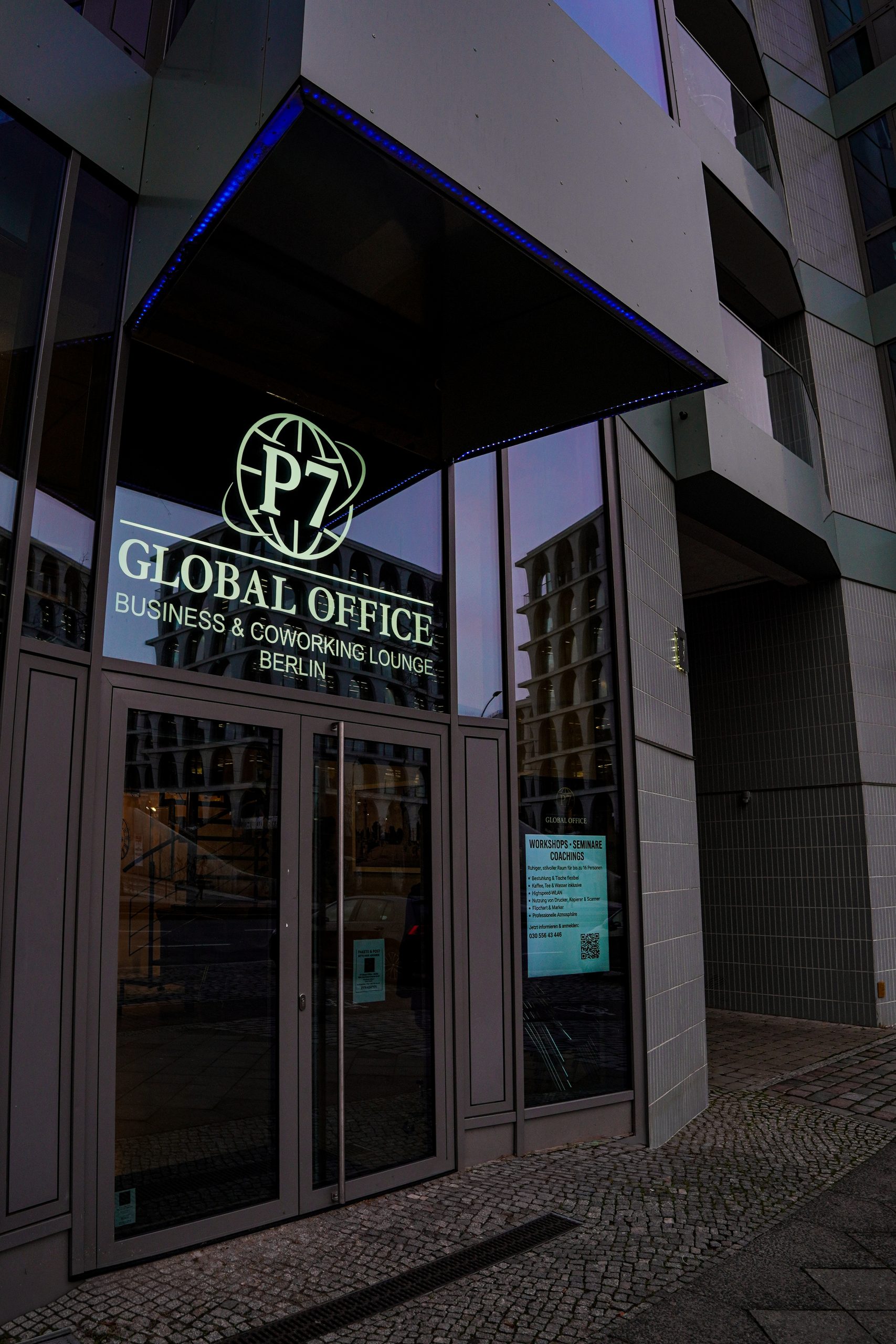 Entrance of the office building at Prenzlauer Allee 7 with the P7 Global Office logo