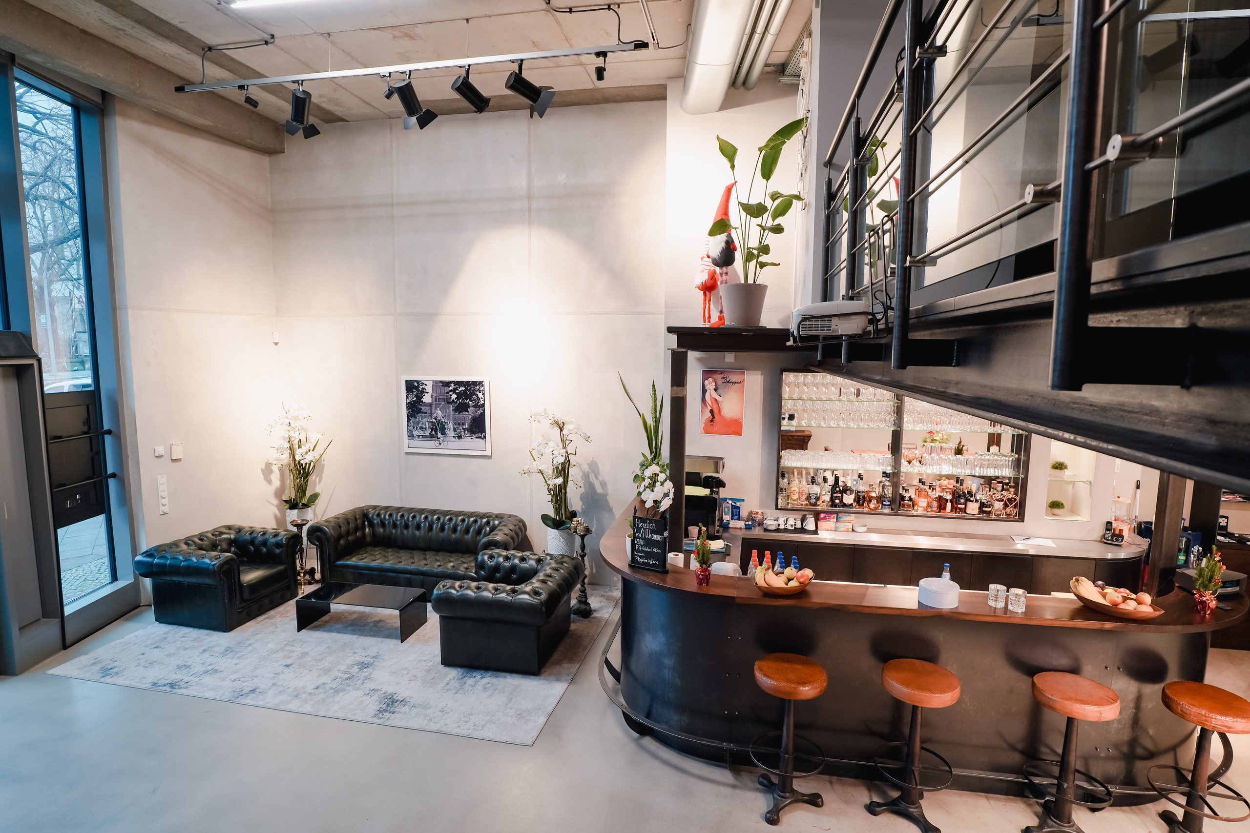 Lounge with Chesterfield seating and bar with bar stools